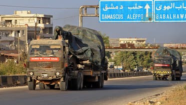 Turkish military vehicles, part of a convoy, drive through the town of Ariha in the rebel-held northwestern Idlib province on October 20, 2020, after vacating the Morek post in Hama's countryside. Turkey started withdrawing from one of its largest outposts in northwest Syria encircled for the past year by Syrian regime forces, a war monitor and a pro-Ankara rebel commander said. The outpost in Morek is Turkey's largest in the northwest province of Hama, which is now mostly under Syrian government control.