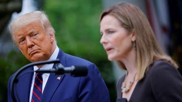 US President Donald Trump watches Judge Amy Coney Barrett deliver remarks as he holds an event to announce her as his nominee to fill the Supreme Court seat, Sept. 26, 2020. (Reuters)