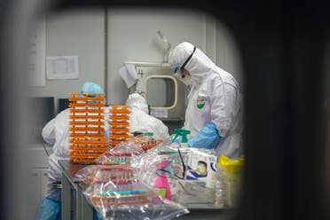 Medical workers in protective suits at a coronavirus detection lab in Wuhan in central China's Hubei Province. (File photo: AP)