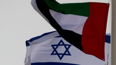 Emirati and Israeli flags fly upon the arrival of Israeli and U.S. delegates at Abu Dhabi International Airport, in Abu Dhabi, United Arab Emirates August 31, 2020. (Reuters)