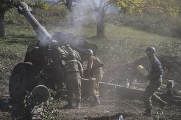 Armenian soldiers fire artillery on the front line on October 25, 2020, during the ongoing fighting between Armenian and Azerbaijani forces over the breakaway region of Nagorno-Karabakh. (AFP)