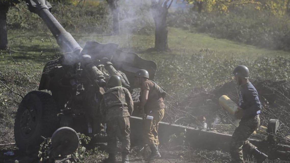 Armenian soldiers fire artillery on the front line on October 25, 2020, during the ongoing fighting between Armenian and Azerbaijani forces over the breakaway region of Nagorno-Karabakh. (AFP)