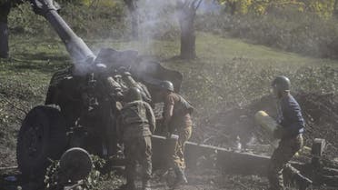 Armenian soldiers fire artillery on the front line on October 25, 2020, during the ongoing fighting between Armenian and Azerbaijani forces over the breakaway region of Nagorno-Karabakh. (AFP)