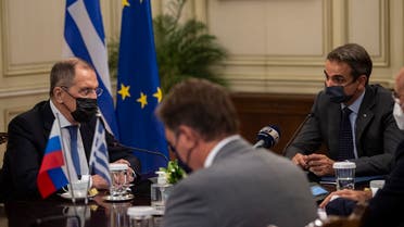 Greek PM Kyriakos Mitsotakis (R) speaks with Russian FM Sergei Lavrov during their meeting at the Maximos Mansion in Athens, on October 26, 2020. (Angelos Tzortzinis/Pool/AFP)