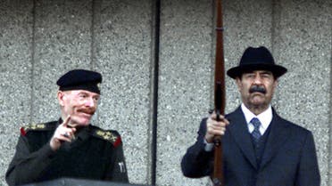 On Dec. 31, 2000, Iraqi President Saddam Hussein (R) and the vice president of the ruling Revolutionary Command Council, Izzat Ibrahim al-Duri, attend a military parade at Baghdad's Victory Square. (AFP)