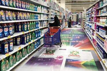 A woman shops for laundry detergent at a supermarket in Saudi Arabia's capital Riyadh on October 18, 2020.  (AFP)