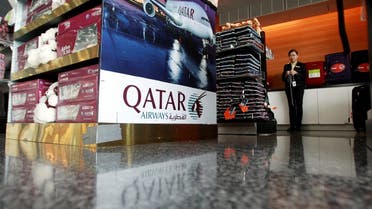 A sign of Qatar Airways is seen at Hamad International Airport in Doha, Qatar. (Reuters)
