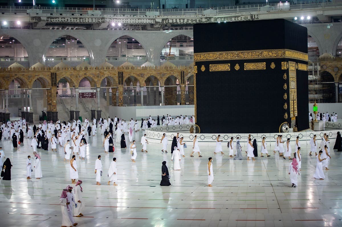 Muslims, keeping a safe social distance, perform Umrah at the Grand Mosque after Saudi authorities ease the coronavirus disease (COVID-19) restrictions, in the holy city of Mecca, Saudi Arabia. (Reuters)