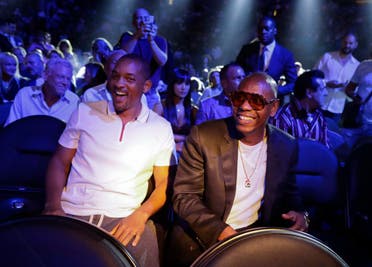 Will Smith, left, and Dave Chapelle wait for the start of a middleweight title fight between Canelo Alvarez and Gennady Golovkin, Saturday, Sept. 15, 2018, in Las Vegas. (AP)