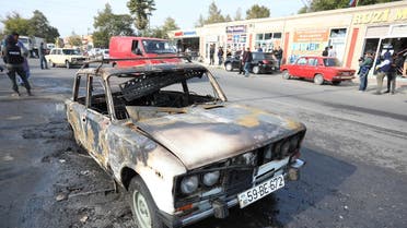 A view shows a burnt car, which was hit by shelling during a military conflict over the breakaway region of Nagorno-Karabakh, in the town of Barda, Azerbaijan October 28, 2020. (Reuters/Aziz Karimov)