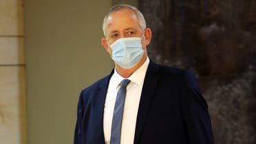 Israeli Defence Minister Benny Gantz wears a protective face mask as he arrives to attend a vote on the approval of the normalisation deal with the United Arab Emirates at the Knesset, Israel's parliament, in Jerusalem October 15, 2020. Alex Kolomoisky/Yedioth Ahronoth?/POOL via REUTERS