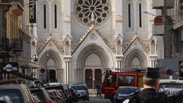 French policemen stand guard a street in front of the Basilica of Notre-Dame de Nice after a knife attack in Nice on October 29, 2020. (AFP)