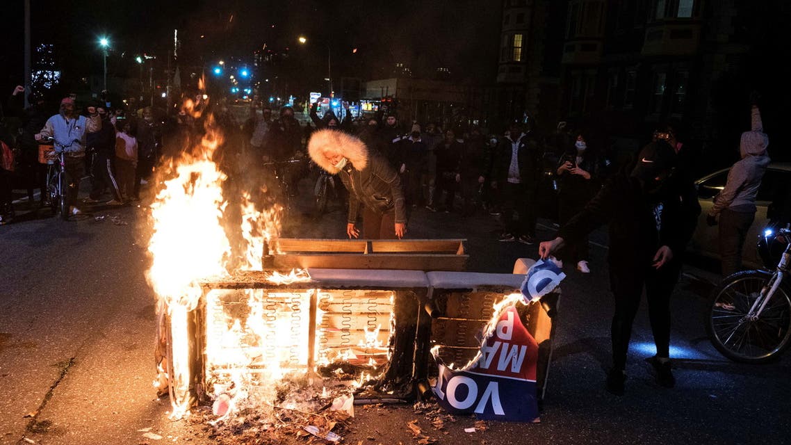 A fire is seen as demonstrators clash with riot police during a rally after the death of Walter Wallace Jr., a Black man who was shot by police in Philadelphia, Pennsylvania, U.S., October 27, 2020. Picture taken October 27, 2020. REUTERS/Yuki Iwamura
