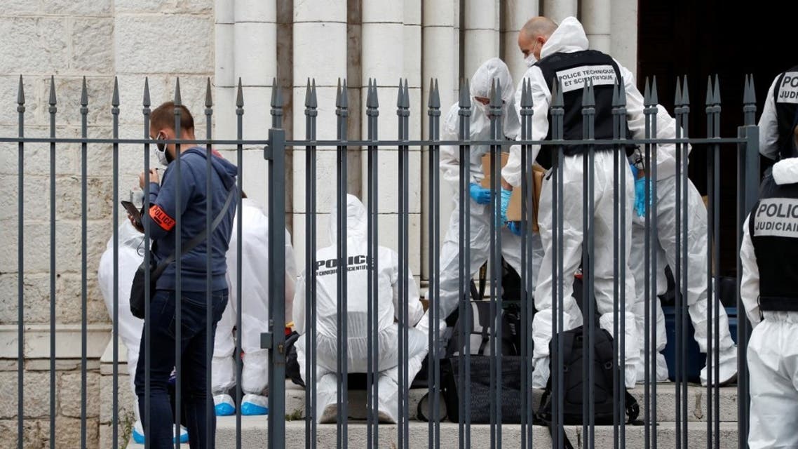 French forensics officers operate outside the Basilica of Notre-Dame de Nice after a knife attack in Nice on October 29, 2020. (AFP)
