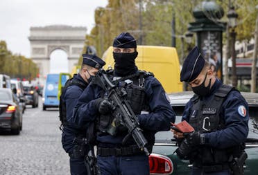French police officers on the Champs-Elysee avenue in Paris, on October 30, 2020. (AFP)
