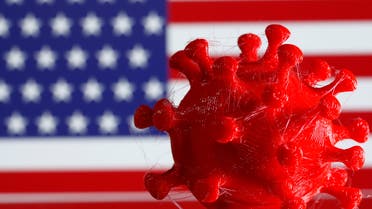 A 3D-printed coronavirus model is seen in front of a U.S. flag on display in this illustration taken March 25, 2020. (Reuters)