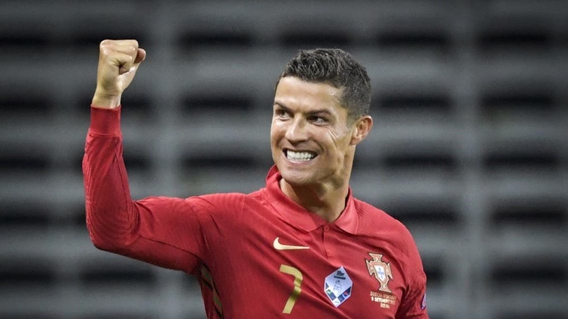 Portugal's forward Cristiano Ronaldo celebrates scoring the opening goal, his 100th goal for Portugal, during the UEFA Nations League football match between Sweden and Portugal on September 8, 2020 in Solna, Sweden. (AFP)
