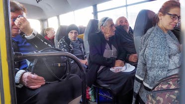 People sit in a bus as they prepare to leave Stepanakert, the separatist region of Nagorno-Karabakh, Oct. 30, 2020. (AP)