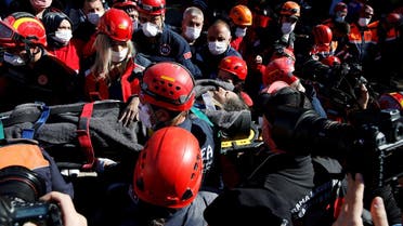 Rescue workers carry a survivor out of a collapsed building after an earthquake in the Aegean port city of Izmir, Turkey October 31, 2020. (Reuters/Kemal Aslan)