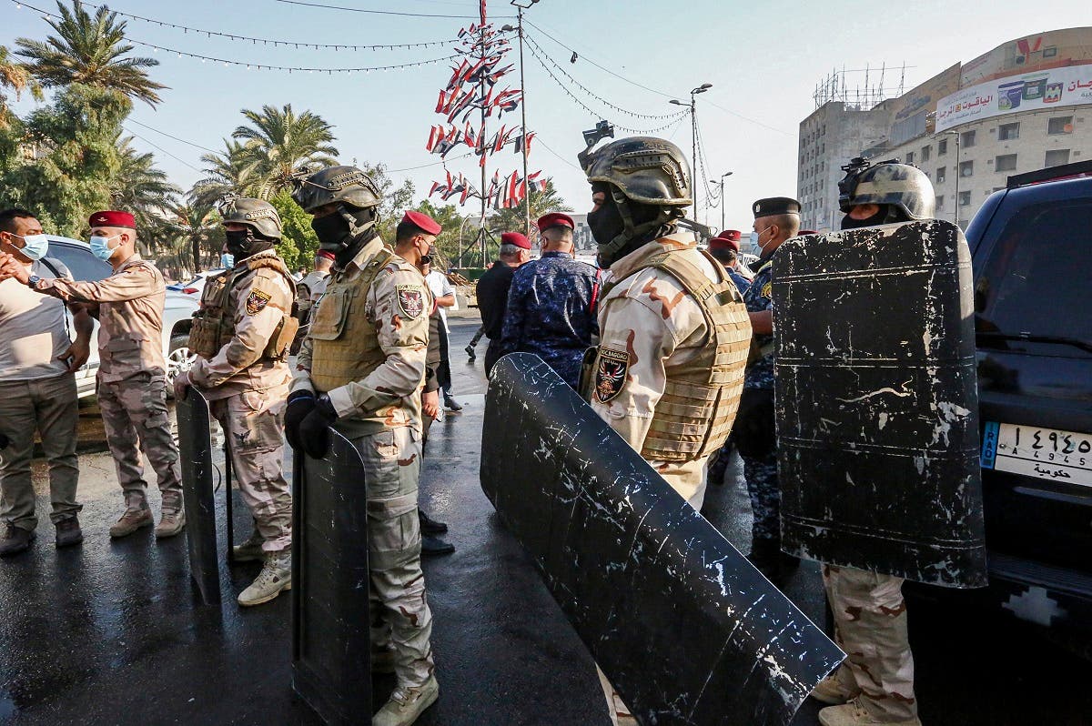 Members of the Iraqi security forces stand guard during the reopening of the Iraqi capital Baghdad’s central Tahrir Square on October 31, 2020. (Sabah Arar/AFP)