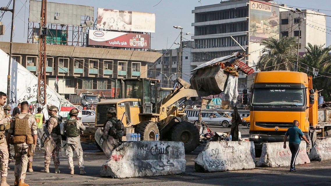A bulldozer clears a path during the reopening of the Iraqi capital Baghdad’s central Tahrir Square on October 31, 2020. (Sabah Arar/AFP)