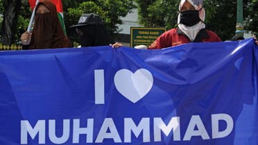 Muslim protesters gather during a demonstration against French President Emmanuel Macron for his comments over the Prophet Mohammed caricatures in Yogyakarta on October 30, 2020. (AFP)