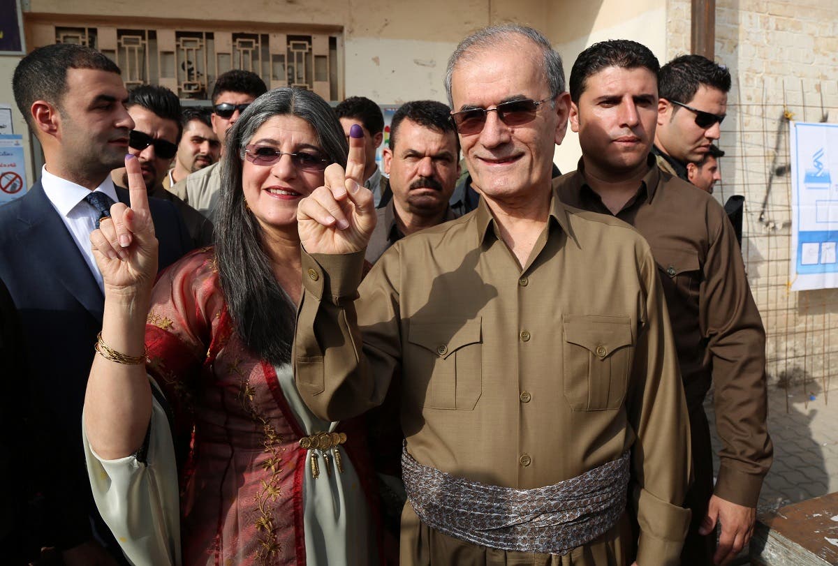 A file photo of Kirkuk provincial Governor Najmeddin Karim (R) shows his ink-stained finger after casting his vote in the Kurdish independence referendum in the city of Kirkuk in northern Iraq, on September 25, 2017. (Marwan Ibrahim/AFP)
