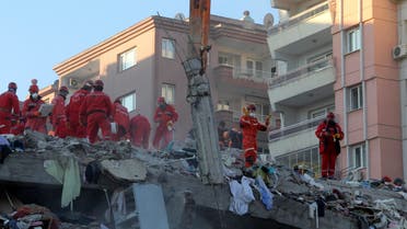 Rescue workers try to rescue residents trapped in debris of a collapsed building, in Izmir, Turkey on Oct. 31, 2020. (AP)