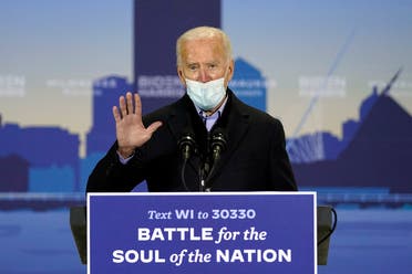 Democratic presidential candidate Joe Biden speaks in a hanger at General Mitchell International Airport, Oct. 30, 2020, in Milwaukee. (AP)