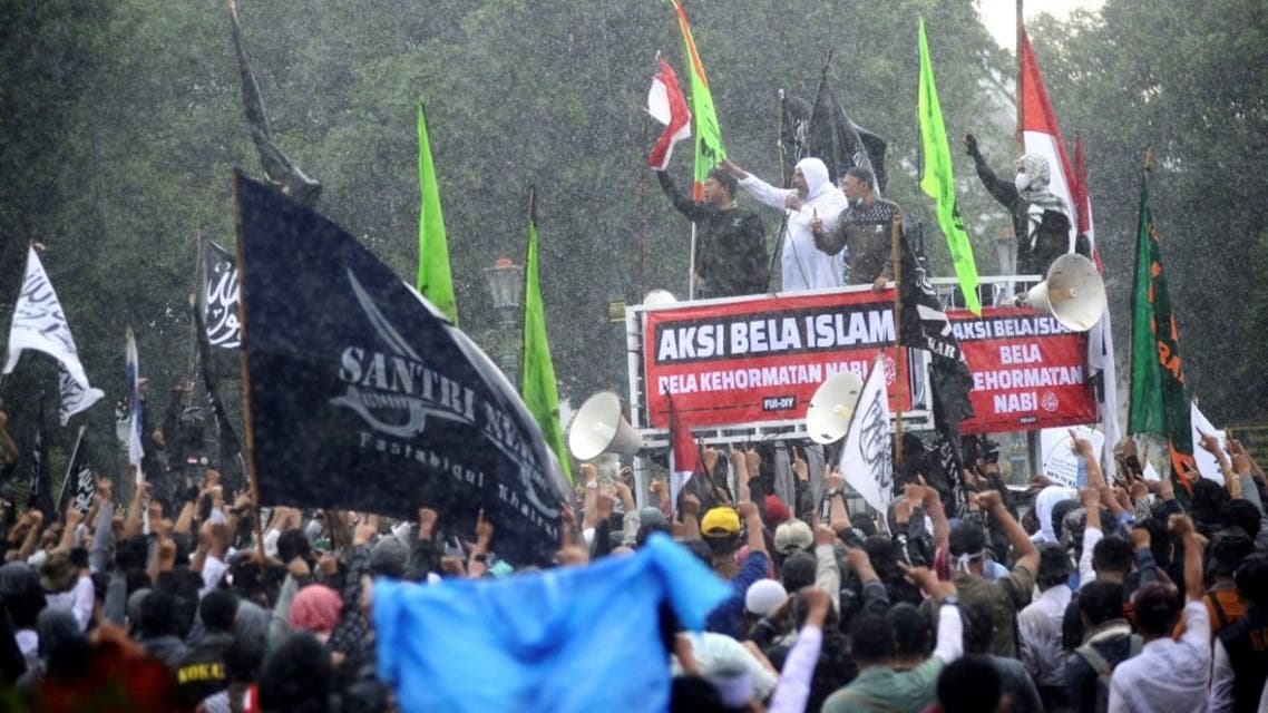 Muslim protesters gather during a demonstration against French President Emmanuel Macron for his comments over the Prophet Mohammed caricatures in Yogyakarta on October 30, 2020. (AFP)