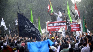 Muslim protesters gather during a demonstration against French President Emmanuel Macron for his comments over the Prophet Mohammed caricatures in Yogyakarta on October 30, 2020. (AFP)