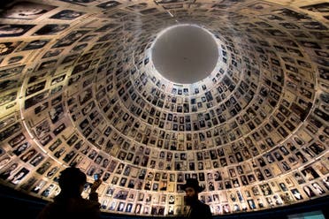 An ultra-Orthodox Jewish couple visits the Hall of Names at the Yad Vashem Holocaust memorial in Jerusalem, ahead of the International Holocaust Remembrance Day on Jan. 26, 2014. (AP)