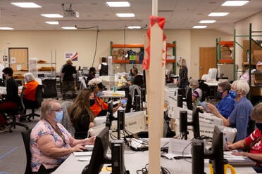 A file photo of early voting and absentee ballots are processed in Tucson, Arizona, US, October 31, 2020. (Reuters)