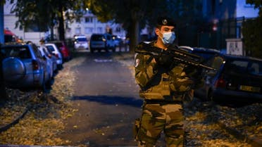 A French soldier stands behind a cordon on October 31, 2020 in Lyon near the scene where an attacker armed with a sawn-off shotgun wounded an Orthodox priest in a shooting before fleeing, said a police source. (AFP)