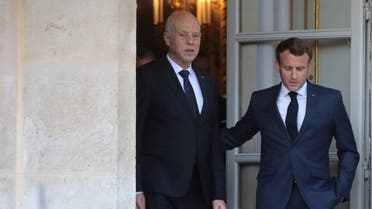 French President Emmanuel Macron (R) and Tunisian President Kais Saied arrive for a joint press conference after their meeting at the Elysee Palace, in Paris, on June 22, 2020. (AFP)
