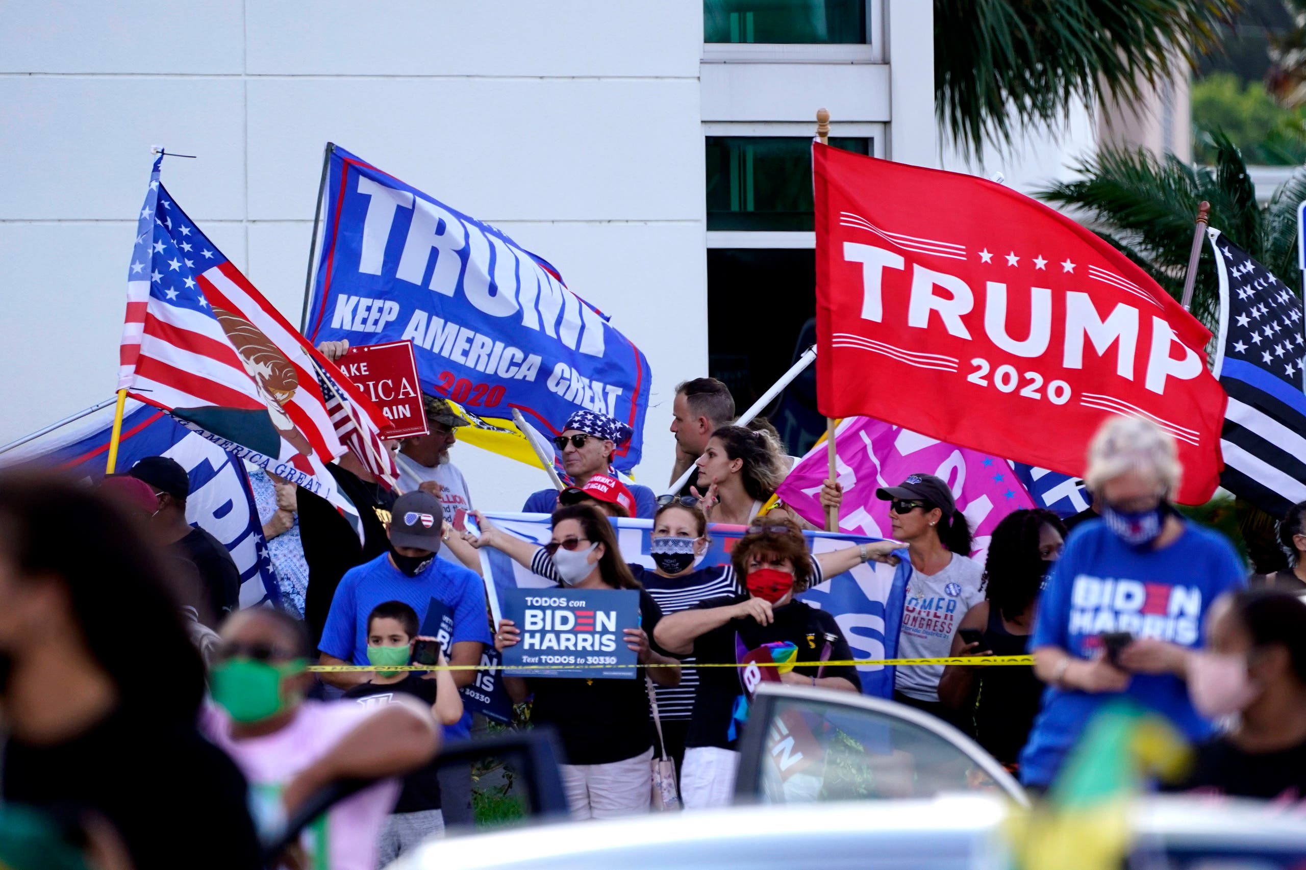 Supporters of President Donald Trump demonstrate outside a drive-in get out the vote rally with Democratic vice presidential candidate Sen. Kamala Harris, D-Calif.,, Saturday, Oct. 31, 2020, at Palm Beach State College in Lake Worth, Fla. (AP)