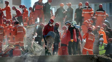 Rescuers are at work during the ongoing search operation at the site of a collapsed building as they look for survivors and victims in the city of Izmir. (AFP)