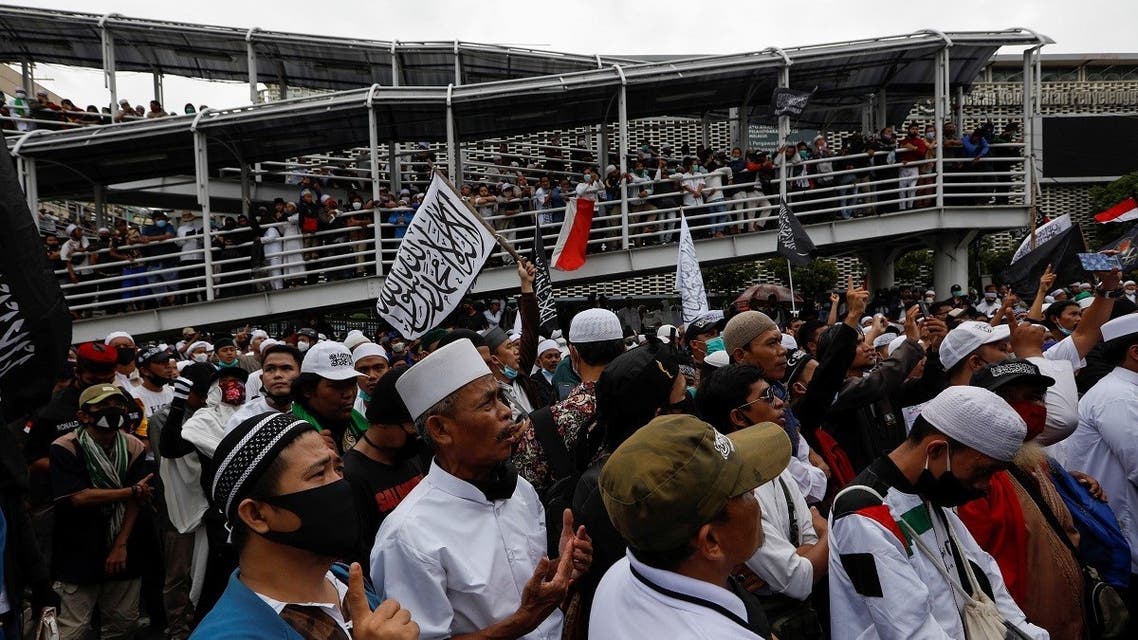 People gather during a protest against the comments of French President Emmanuel Macron considered insulting to the Prophet of Muhammad and Muslims, on the main road near the French Embassy in Jakarta, Indonesia, on November 2, 2020. (Reuters)