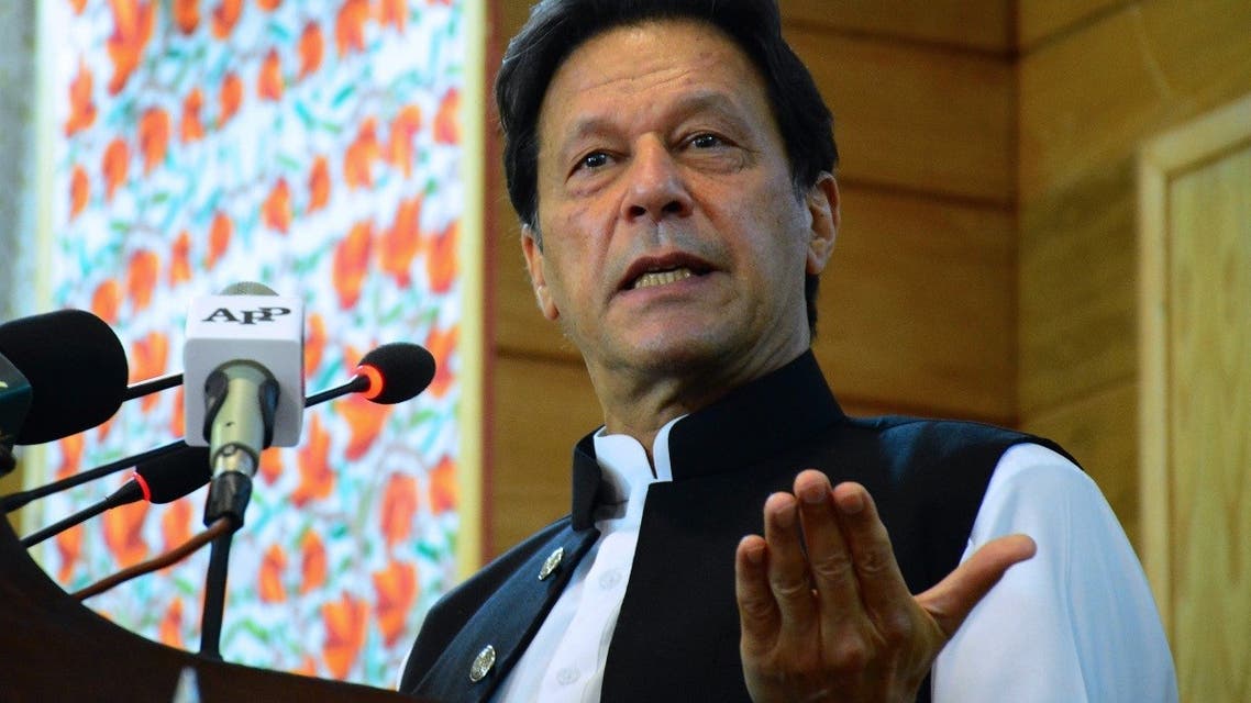Pakistan's Prime Minister Imran Khan addresses the legislative assembly in Muzaffarabad, the capital of Pakistan-controlled Kashmir on August 5, 2020, to mark the one-year anniversary after New Delhi imposed direct rule on Indian-administered Kashmir. (AFP)