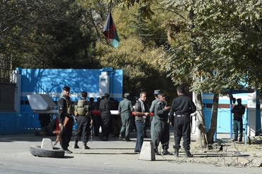 Policemen stand guard at an entrance gate of the Kabul University in Kabul on November 2, 2020. (Wakil Kohsar/AFP)