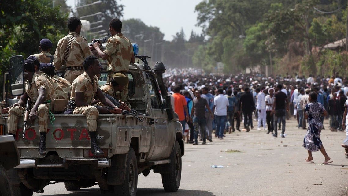 A file photo of Oromo regional police officers wait in a pickup car during the Oromo new year holiday Irreechaa in Bishoftu on October 2, 2016. (Zacharias Abubeker/AFP)