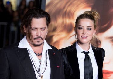 In this file photo taken on November 22, 2015 Actors Johnny Depp (L) and Amber Heard attend the Los Angeles Premiere of “The Danish Girl”, in Westwood, California, on November 21, 2015. (Valerie Macon/AFP)
