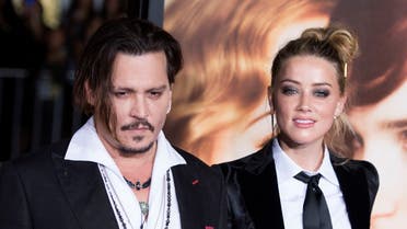 In this file photo taken on November 22, 2015 Actors Johnny Depp (L) and Amber Heard attend the Los Angeles Premiere of “The Danish Girl”, in Westwood, California, on November 21, 2015. (Valerie Macon/AFP)