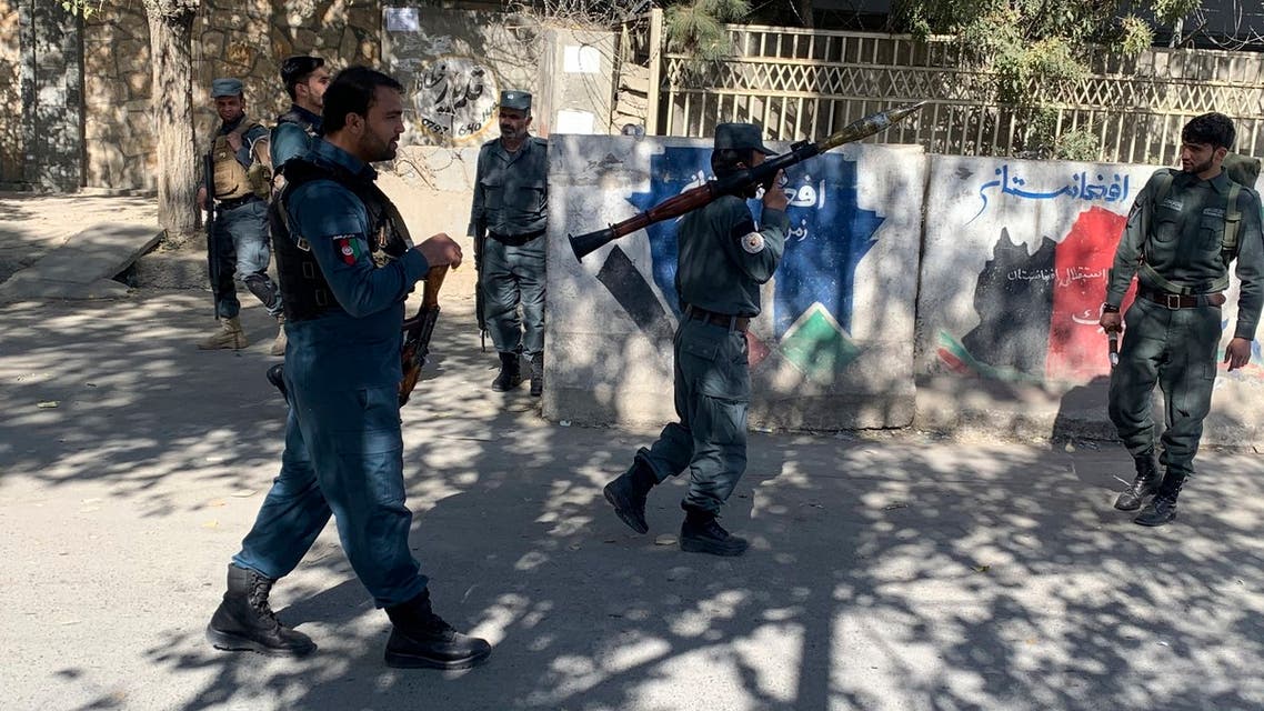 Afghan police arrive at the site of an attack at Kabul University in Kabul, Afghanistan, Monday, Nov. 2, 2020. Gunfire erupted at the university in the Afghan capital early Monday and police have surrounded the sprawling campus, authorities said. (AP Photo/Rahmat Gul)