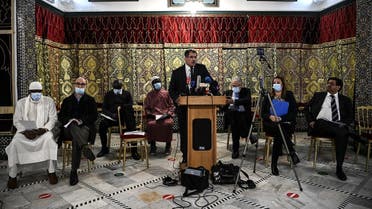 President of the Rassemblement des Musulmans de France (RMF) Anouar Kbibech (C) addresses a press conference, called by several national Muslim federations at the Great Mosque in Paris on November 2, 2020. (Christophe Archambault/AFP)