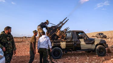 An anti-aircraft gun fires rounds in tribute during the funeral of General Wanis Bukhamada, commander of the Saiqa (Special Forces) of the Libyan National Army (LNA) loyal to strongman Khalifa Haftar, in the eastern city of Benghazi on November 1, 2020. (AFP)