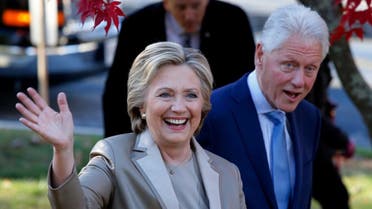 Hillary Clinton and former President Bill Clinton greet supporters after casting their ballots in Chappaqua, New York on November 8, 2016. (AFP)