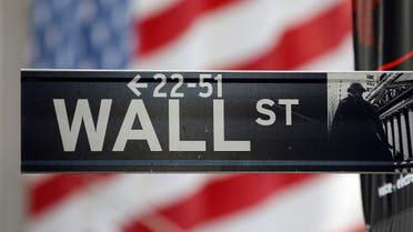 A sign for Wall Street is seen with an American flag in the background across from the New York Stock Exchange. (File Photo: Reuters)
