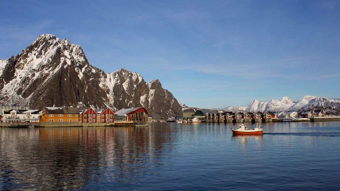 A fishing boat enters the harbour at the Arctic port of Svolvaer in northern Norway March 4, 2013. Oil companies seeking new Arctic areas for exploration face a battle with environmentalists, fishermen and hotel owners over Norwegian islands where jagged snow-capped peaks rise sheer from the sea. (Reuters)