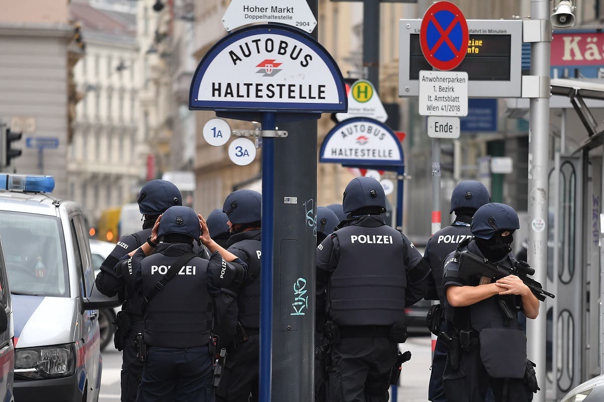 Policemen stand in front of a bus stop at Hoher Markt in Vienna on November 3, 2020, one day after a shooting at multiple locations across central Vienna. (Joe Klamar/AFP)